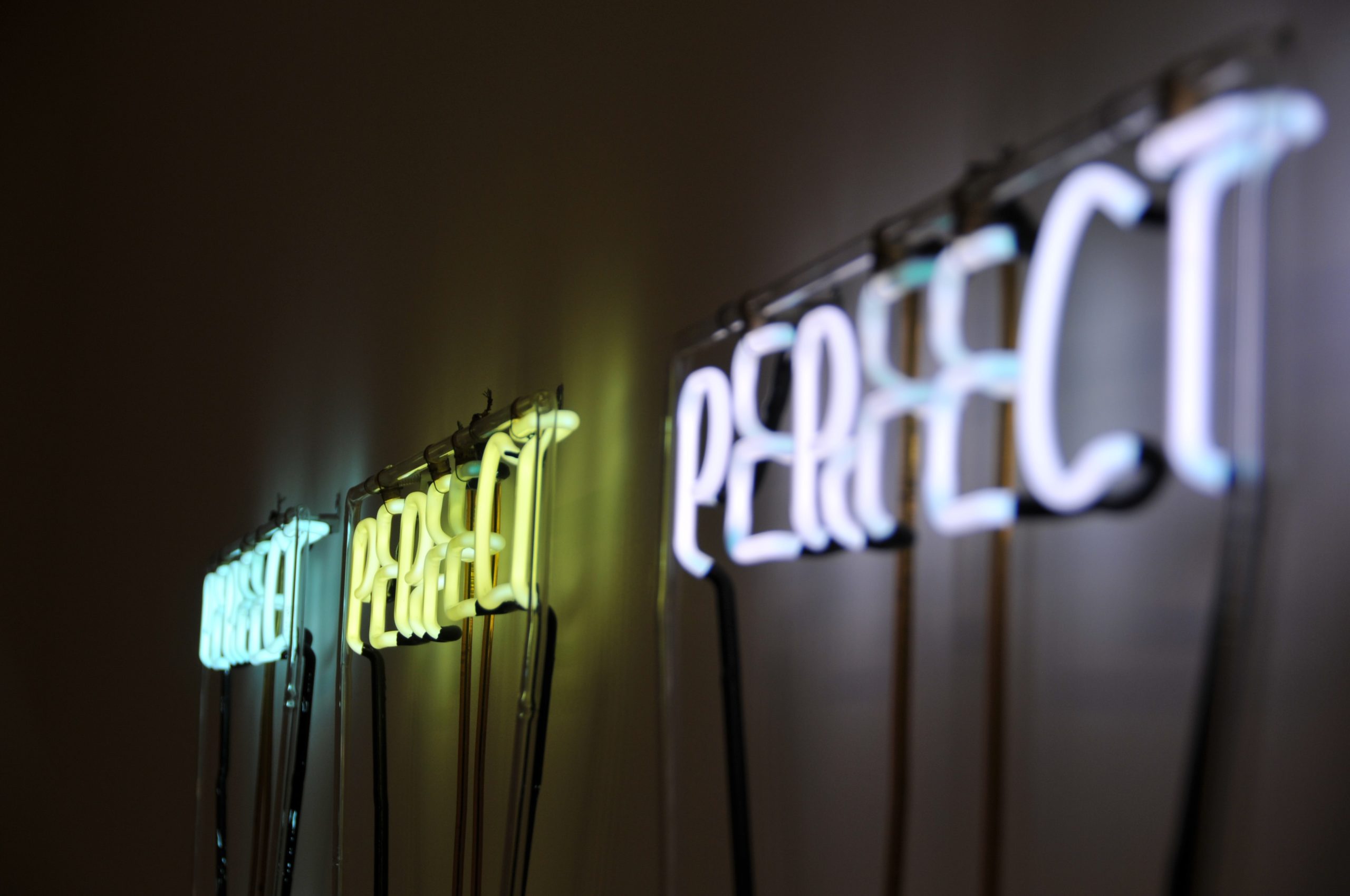 Neon signs that say the word perfect